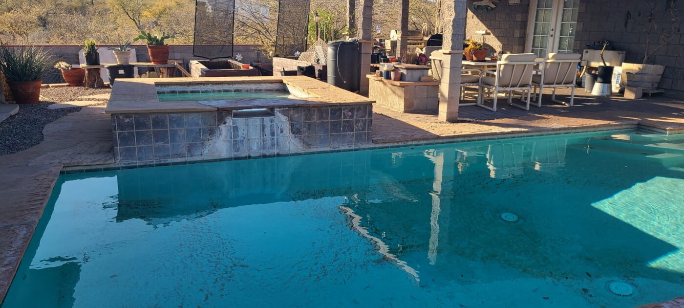 A clear East Valley pool and spa in a desert backyard